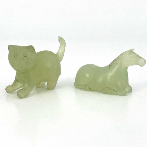 507 - Two Chinese carved jade figures of a cat and horse, pale opaque green, 6cm (2)