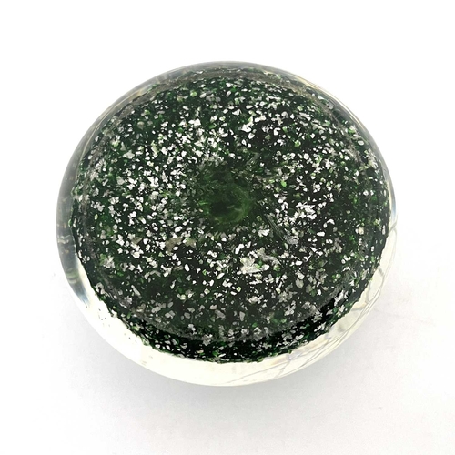 512 - Riedel, a random cane millefiori glass paperweight, late 19th century, mica gravel green ground with... 