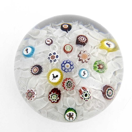 513 - Baccarat, a Gridel spaced millefiori glass paperweight, 19th century, random scattering of canes inc... 