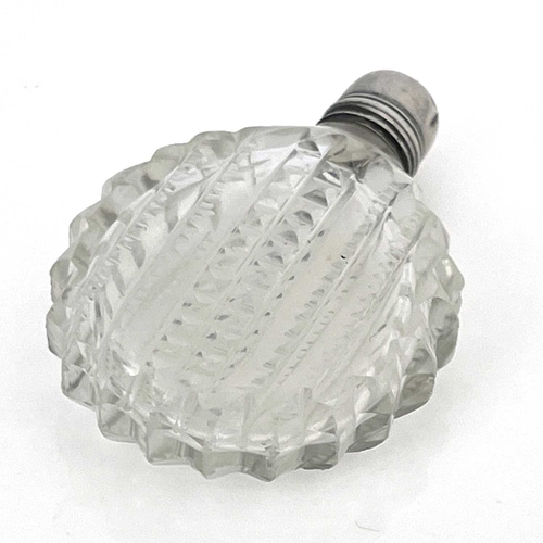 516 - An Irish cut glass scent bottle, circa 1790, circular form, prism cut and notched design, with silve... 