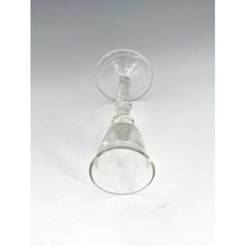 519 - A double knopped air twist wine glass, the bell shaped bowl on a double series helical stem with cen... 