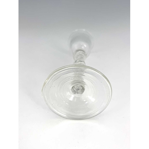 519 - A double knopped air twist wine glass, the bell shaped bowl on a double series helical stem with cen... 