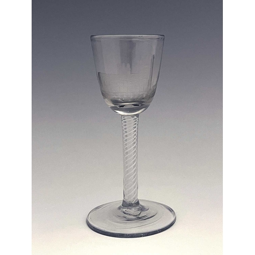 520 - An opaque twist wine glass, circa 1765, the round funnel bowl engraved with a church and disguised m... 