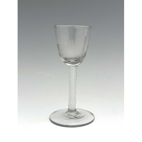 520 - An opaque twist wine glass, circa 1765, the round funnel bowl engraved with a church and disguised m... 