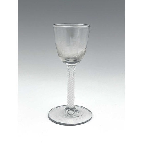 520 - An opaque twist wine glass, circa 1765, the round funnel bowl engraved with a church and disguised m... 