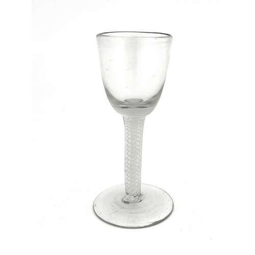 526 - An opaque twist wine glass, circa 1760, the round funnel bowl on a double series multi strand spiral... 