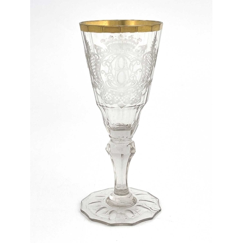 530 - A Silesian Warmbrunn engraved wine glass, the 16 panel faceted fluted funnel shaped bowl finely engr... 