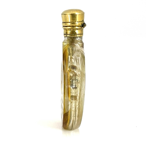 535 - A 19th century Bohemian amber flash cut glass scent bottle, shouldered shield form, engraved with a ... 