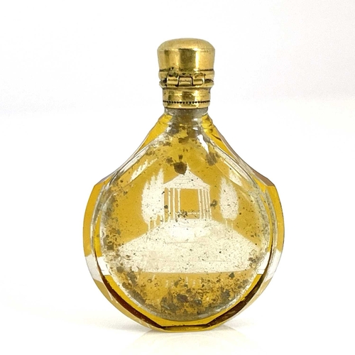 535 - A 19th century Bohemian amber flash cut glass scent bottle, shouldered shield form, engraved with a ... 