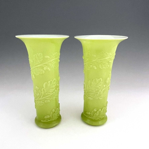 541 - Baccarat, a pair of French cased opaline glass vases, circa 1850s, flared trumpet form, relief mould... 