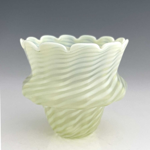 559 - An Arts and Crafts opalescent glass light shade, bulbous gourd form, opaque wrythen stripes, frosted... 