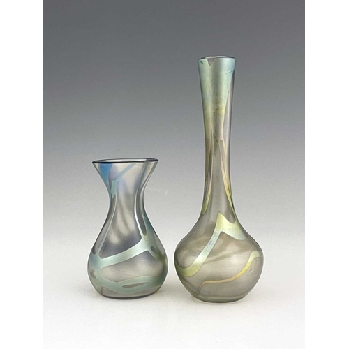 636 - Okra, two iridescent studio glass vases, baluster and bulbous forms, with veined lustre webbing over... 