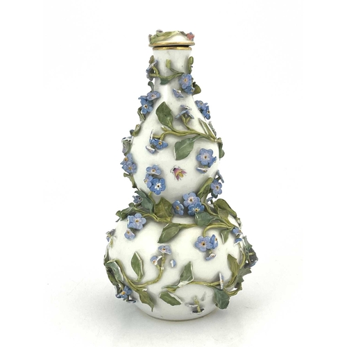 678 - A Continental porcleain bottle flask and cover, circa 1820, double gourd form, encrusted with forget... 