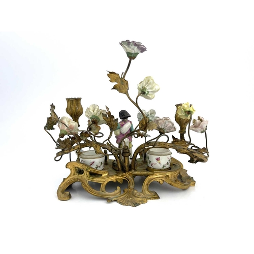 682 - A German porcelain and ormolu mounted florally encrusted figural desk stand, in the Meissen style, t... 