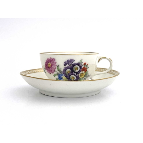 683 - A Meissen Marcolini period tea cup and saucer, circa 1780, painted with floral sprays and flower vig... 