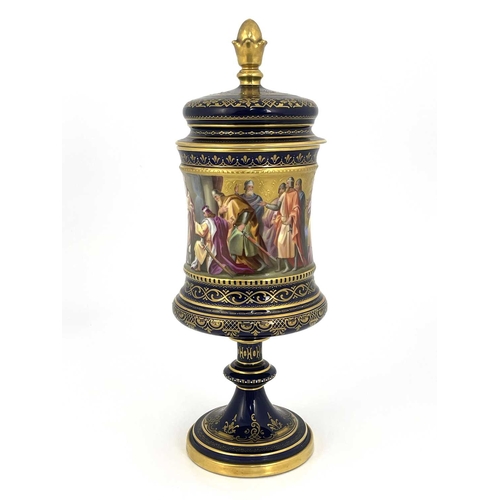 689 - A Vienna porcelain pedestal cup and cover, Campana chalice form, painted in the round with Karl von ... 