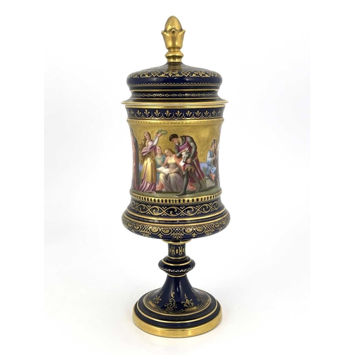 689 - A Vienna porcelain pedestal cup and cover, Campana chalice form, painted in the round with Karl von ... 