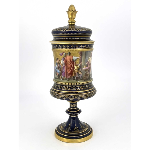 689 - A Vienna porcelain pedestal cup and cover, Campana chalice form, painted in the round with Karl von ... 