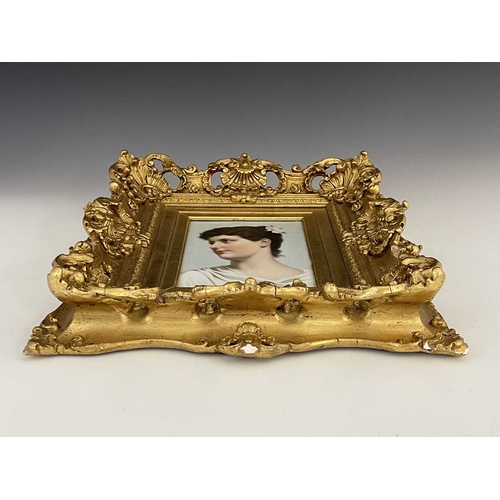 697 - A Continental handpainted porcelain plaque, circa 1890, decorated with a portrait of a young lady, h... 