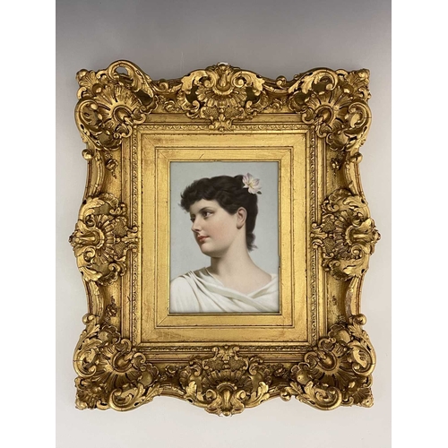 697 - A Continental handpainted porcelain plaque, circa 1890, decorated with a portrait of a young lady, h... 