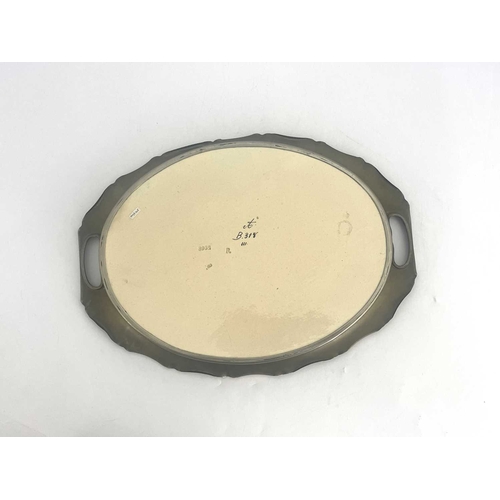 705 - Carl Luber for Johann von Schwarz, an Art Nouveau dust pressed oval tray, decorated with a maiden an... 