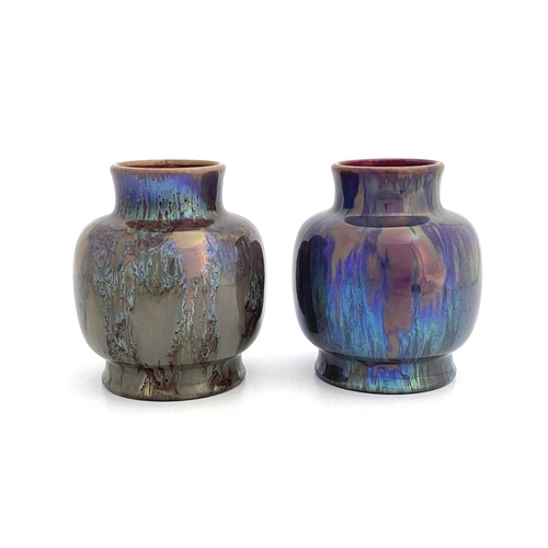 706 - A pair of Dutch iridescent art pottery vases, St Lukas, Utrecht, shouldered ovoid form, marbled lust... 