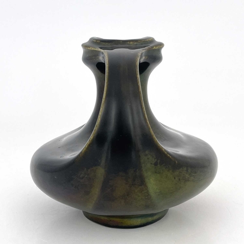 707 - Heliosine, an Austrian Secessionist twin handled lustre vase, organic Grecian boat form, bronzed iri... 