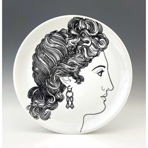 710 - Pierro Fornasetti for Eschenbach, a pair of Le Bellezze plates, circa 1950s, decorated in black with... 