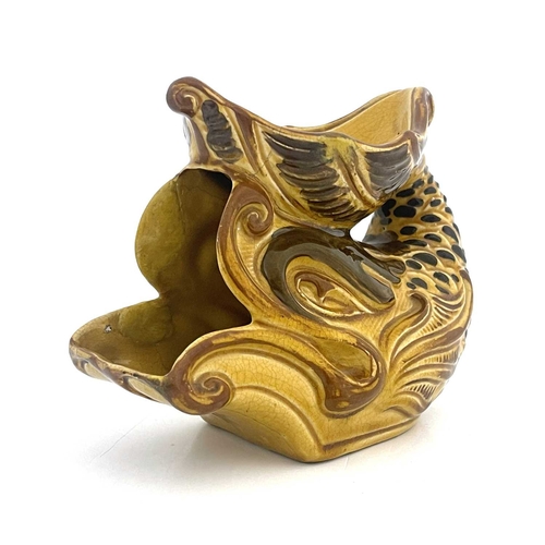 722 - An Aller Vale pottery shaving mug, modelled as a grotesque fish or dolphin, the curved tail fin form... 