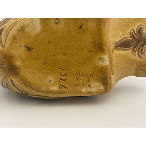 722 - An Aller Vale pottery shaving mug, modelled as a grotesque fish or dolphin, the curved tail fin form... 