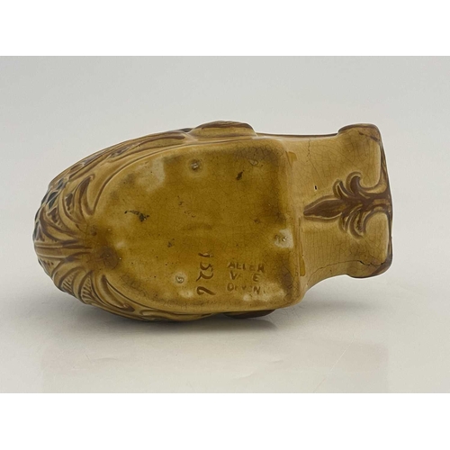 722 - An Aller Vale pottery shaving mug, modelled as a grotesque fish or dolphin, the curved tail fin form... 