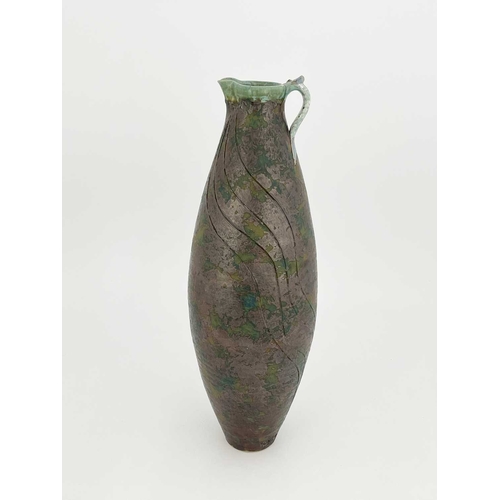 744 - Roger Cockram, a large studio pottery jug, elongated ovoid form with sgraffito line decoration on ox... 