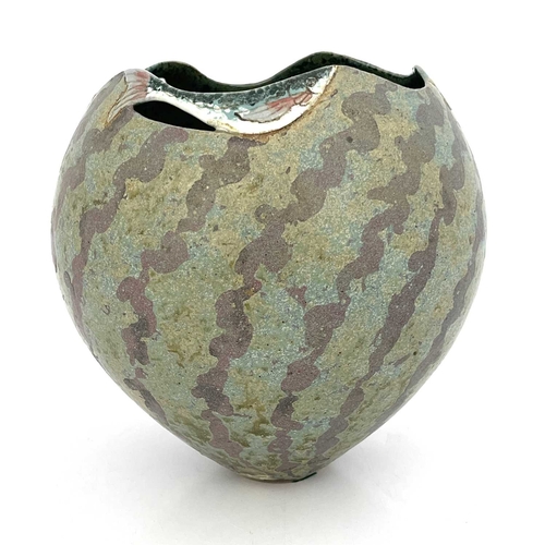 745 - Roger Cockram, a studio pottery vase, ovoid form the rim modelled with three swimming fish, on a mat... 