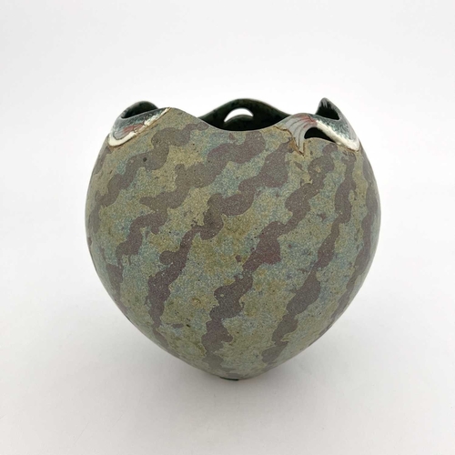 745 - Roger Cockram, a studio pottery vase, ovoid form the rim modelled with three swimming fish, on a mat... 