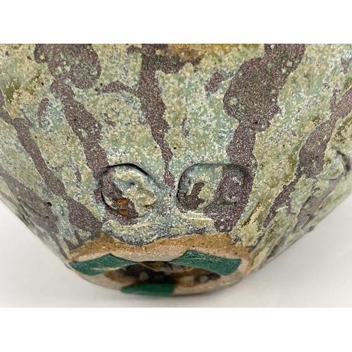 745 - Roger Cockram, a studio pottery vase, ovoid form the rim modelled with three swimming fish, on a mat... 