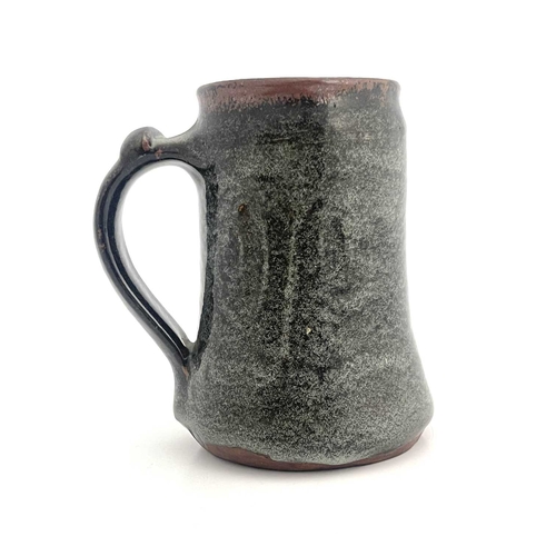 746 - Gugong Bong, an Abuja studio pottery mug, circa 1967-71, tankard form, tenmoku glazed with spiral de... 