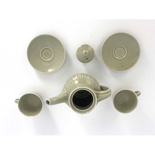 747 - Harry Davis for Crowan Pottery, a studio porcelain coffee pot and two cups and saucers, celadon glaz... 