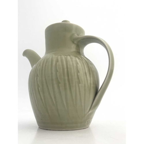 747 - Harry Davis for Crowan Pottery, a studio porcelain coffee pot and two cups and saucers, celadon glaz... 