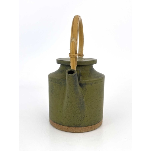 749 - Robin Welch (British, 1936- 2019), a stoneware teapot with a cane handle, impressed maker's mark nea... 