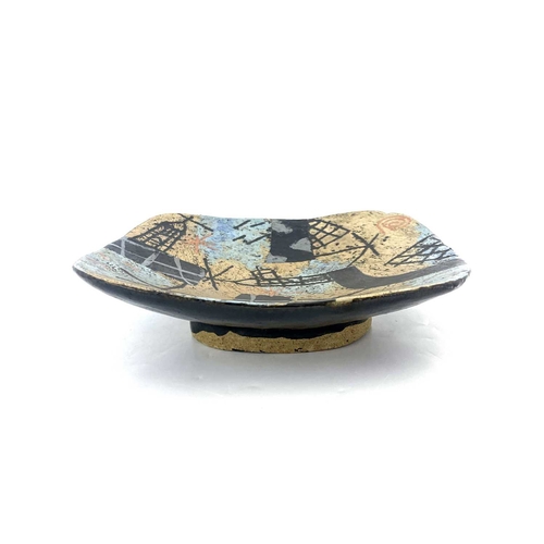 762 - John Maltby (British, 1936- 2020), a stoneware squared press dish, Lighthouses and Fishing Nets, cir... 