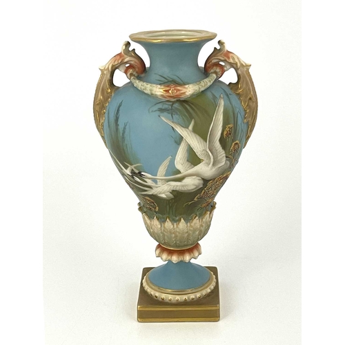 770 - Charles Baldwyn for Royal Worcester, a twin handled vase,1899, double gourd pedestal urn form, acant... 