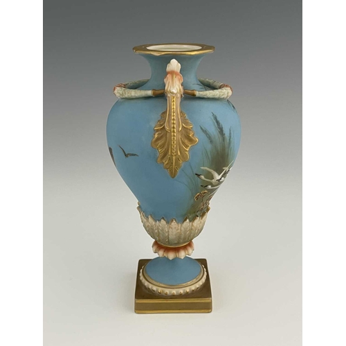 779 - Charles Baldwyn for Royal Worcester, a twin handled vase,1899, double gourd pedestal urn form, acant... 