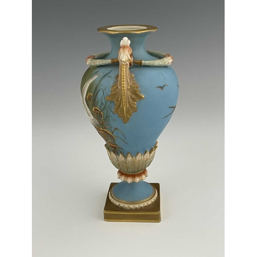 779 - Charles Baldwyn for Royal Worcester, a twin handled vase,1899, double gourd pedestal urn form, acant... 