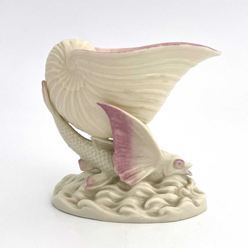 782 - A Belleek second period flying fish pedestal bowl, modelled as a shell supported by a winged fish on... 