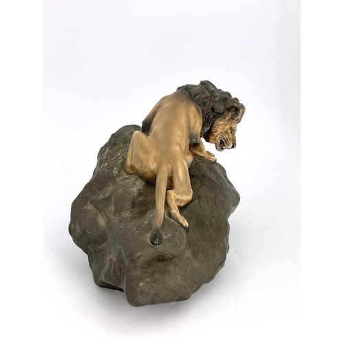 785 - A Royal Doulton figure of a lion on a rock, HN2461, gloss and matte glazed, 45cm long