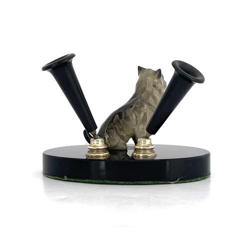 786 - A Royal Doulton dog pen holder, the black base with a terrier dog Note: this actual pen stand is ill... 