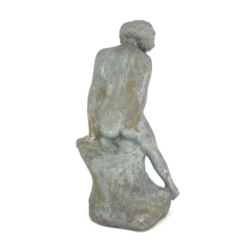 788 - Leslie Harradine for Royal Doulton, a stoneware garden sculpture, modelled as a nude child on a rock... 