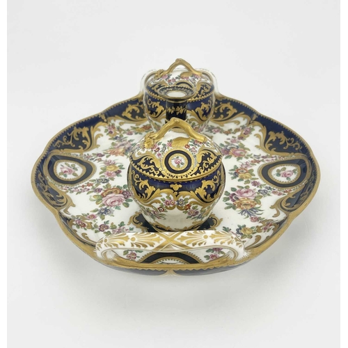 794 - A Coalport inkstand, circa 1830, oval ogee twin handled form, the two fixed lidded inkwells with bra... 