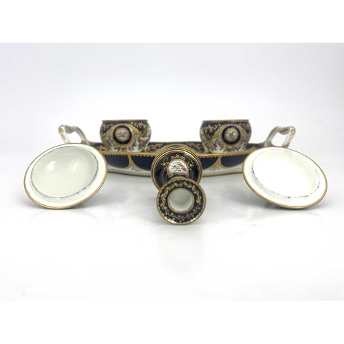 794 - A Coalport inkstand, circa 1830, oval ogee twin handled form, the two fixed lidded inkwells with bra... 