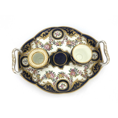 794 - A Coalport inkstand, circa 1830, oval ogee twin handled form, the two fixed lidded inkwells with bra... 